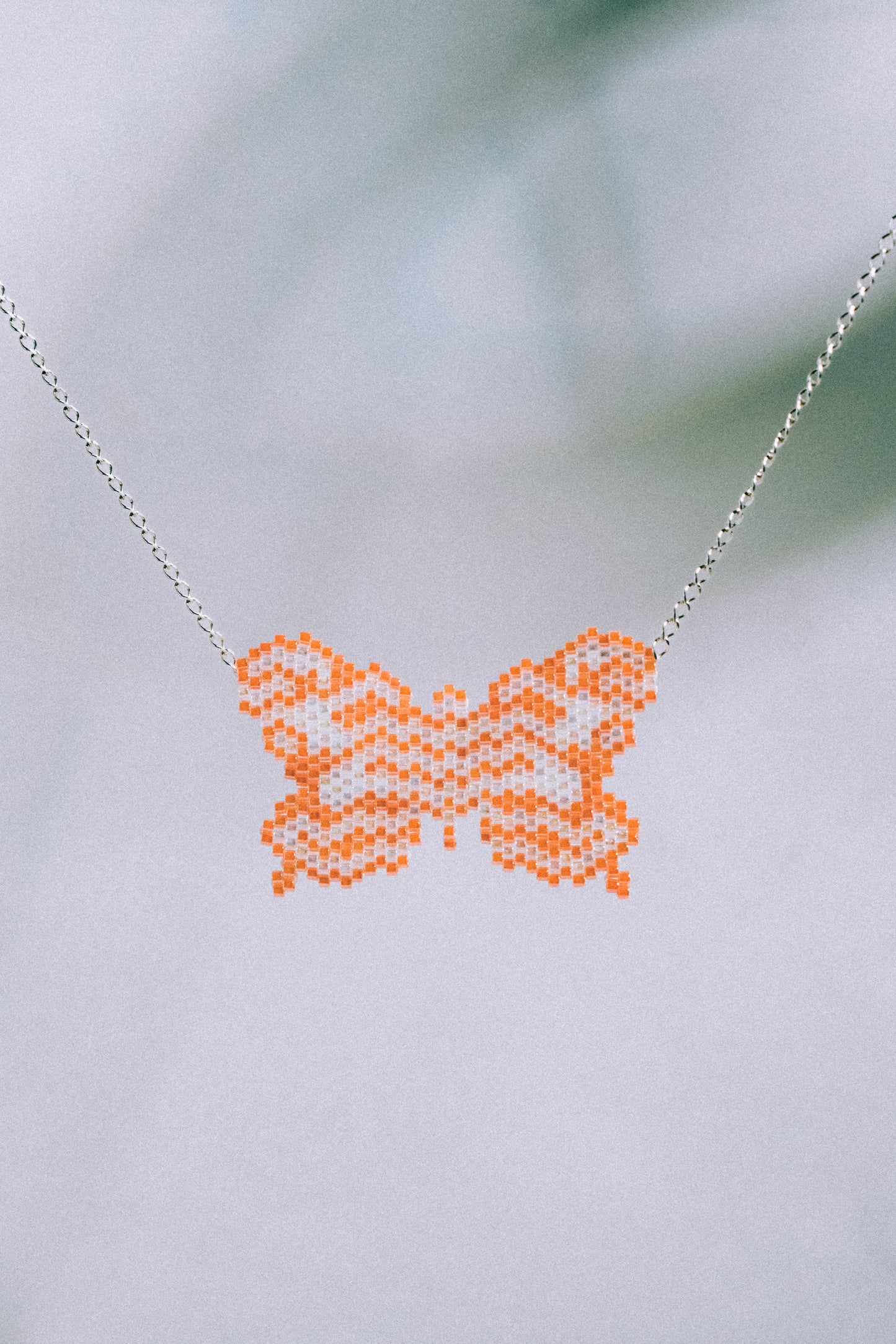 Orange butterfly necklace
